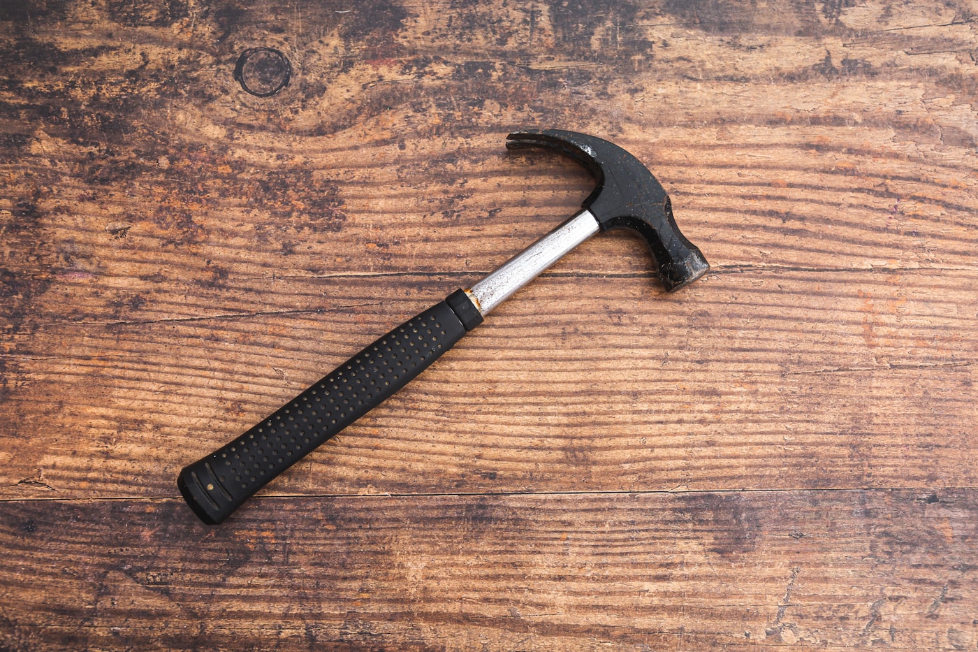 Tape measure, pliers, screwdrivers, hammer, level, and utility knife in an open tool box
