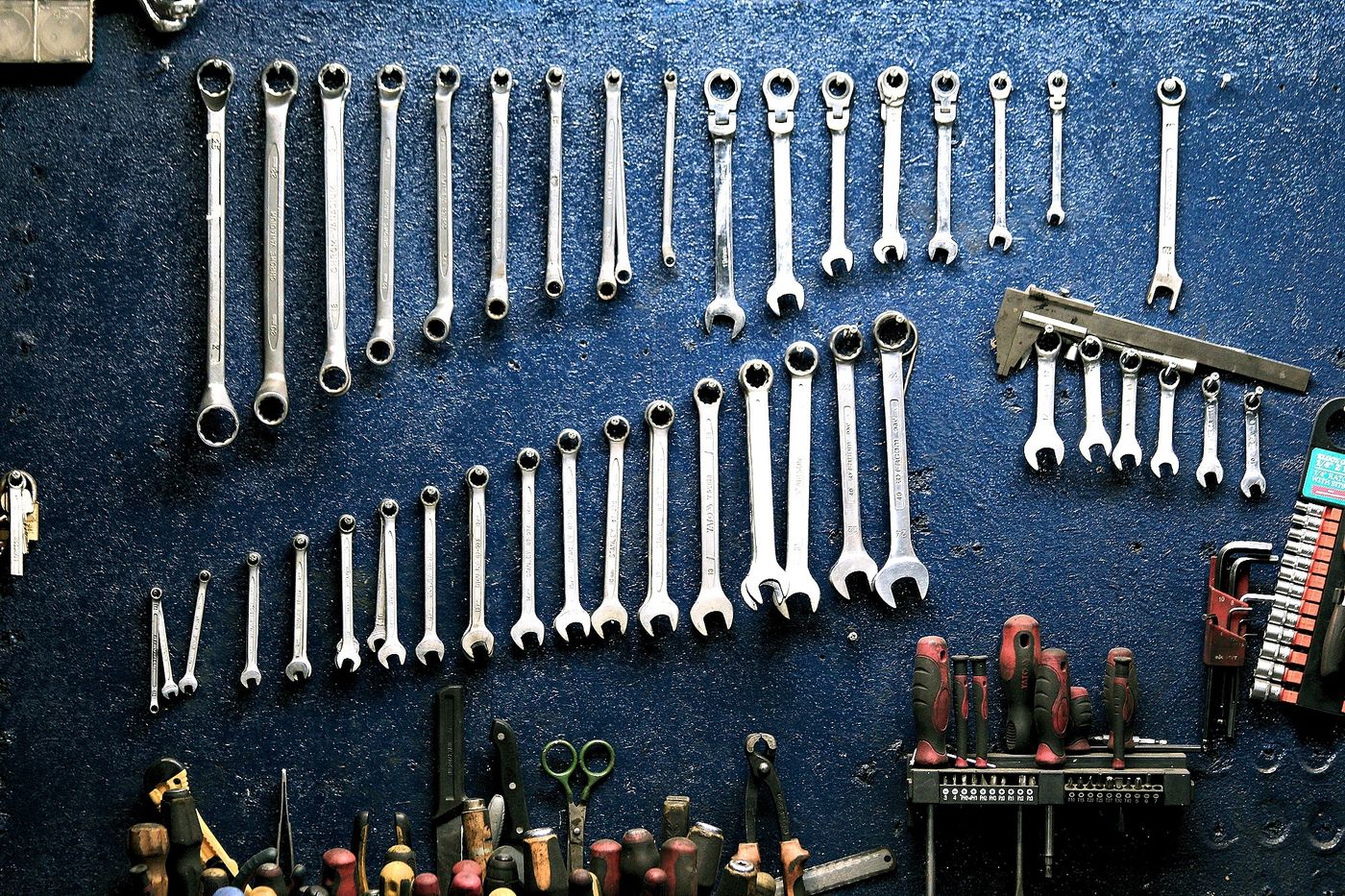 Well-used hand tools arranged on a workbench